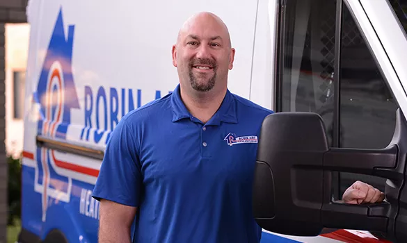 robin aire service company matthew winnie smiling beside servic vehicle