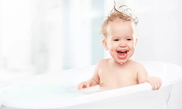 happy smiling baby in warm bathtub robin aire service company